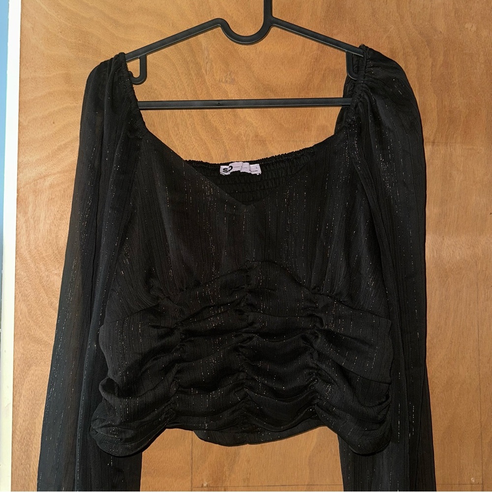 Elegant Black Women's Top with sheer sleeves